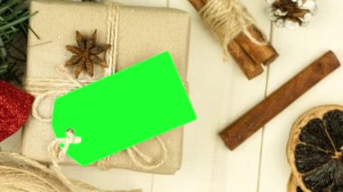 Box with twine and tag, background with copy space. Chroma key. Christmas card. View from above. Copy space - image. Camera zoom