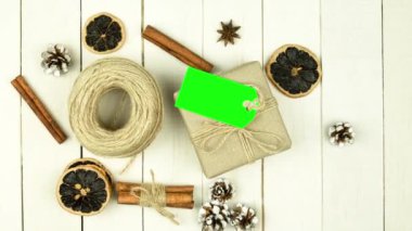 Box with twine and tag, background with copy space. Chroma key. Christmas card. View from above. Copy space - image. Camera zoom