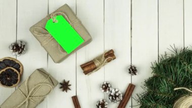 Box with twine and tag, background with copy space. Chroma key. Christmas card. View from above. Copy space - image. Camera zoom