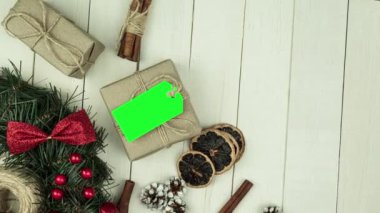 Box with twine and tag, background with copy space. Chroma key. Christmas card. View from above. Copy space - image. Camera zoom