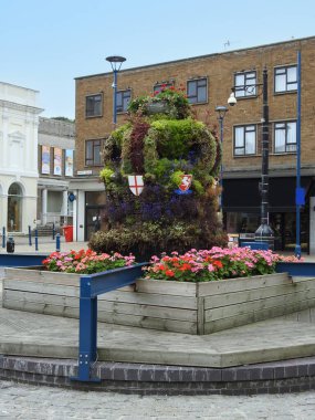 A large flower pot in the streets of the town