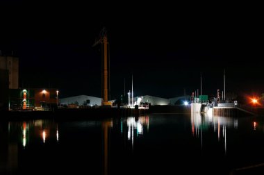 The docks at night on the river Witham with reflections in water