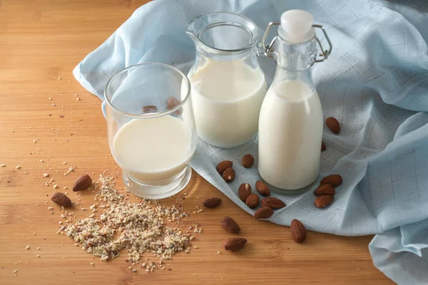 Vegan Milk Almonds Glass Jars Blue Napkin Wooden Table Environmentally — Stockfoto