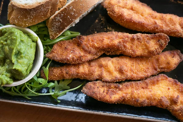 Fried Chicken Sticks Guacamole Dip Bread Arugula Leaves Tasty Snack — Stock Photo, Image