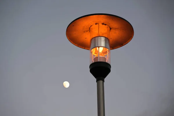 Street Lamp Warm Light Copper Roof Gray Sky Small Waxing — Stock Photo, Image