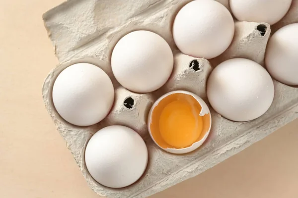 White Eggs Box One Open Shell Showing Yellow Egg Yolk — Stock Photo, Image