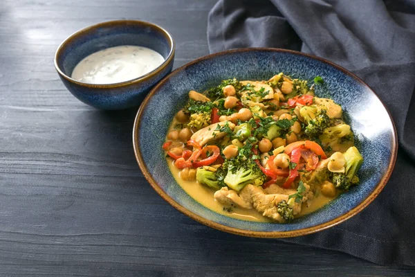 Curry Meal Chickpeas Vegetables Chicken Yogurt Separate Bowl Dark Blue — Stock Photo, Image