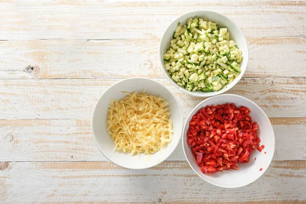 Diced Vegetables Zucchini Red Bell Pepper Grated Cheese White Bowls — Stock Photo, Image