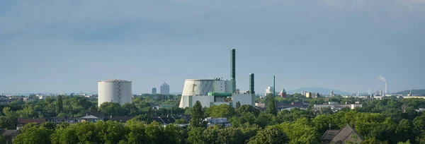 Industrial landscape panorama of Duisburg Wanheim, gas-fired power plant with steam accumulator and cooling tower, can also be operated with fuel oil in case of gas shortage, copy space