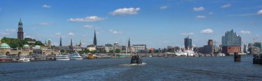 Skyline of Hamburg, Germany, panorama with churches, buildings, ships and Elbphilharmonie, seen from the port on the river Elbe, blue sky, copy space, selected focus