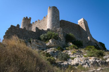 Medieval castle of Alcala de Chivert on a day with blue sky, Castellon, Spain