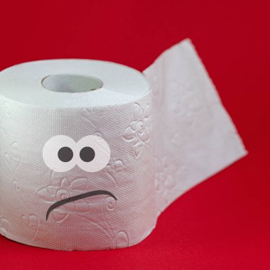 Toilet paper with angry face against red background clipart