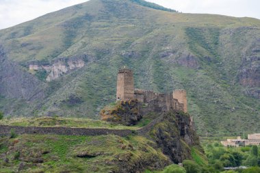 the ruined fortress is visible from the road