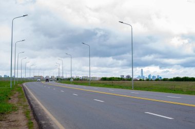 perspective of paved road and sky before rain. High quality photo