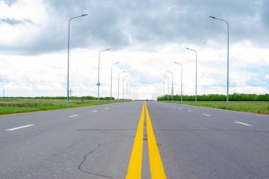 perspective of paved road and sky before rain. High quality photo