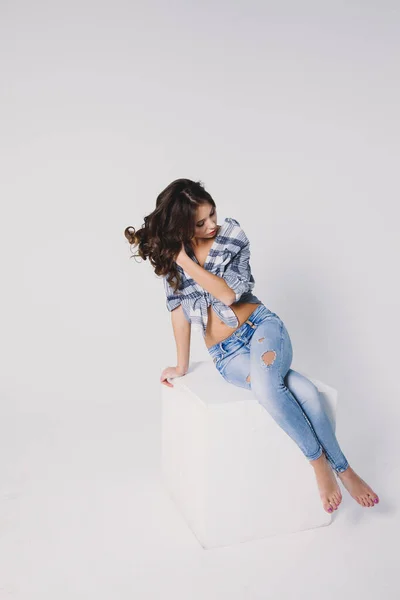 Girl Plaid Shirt Jeans Sits White Cube White Background — Stock Photo, Image