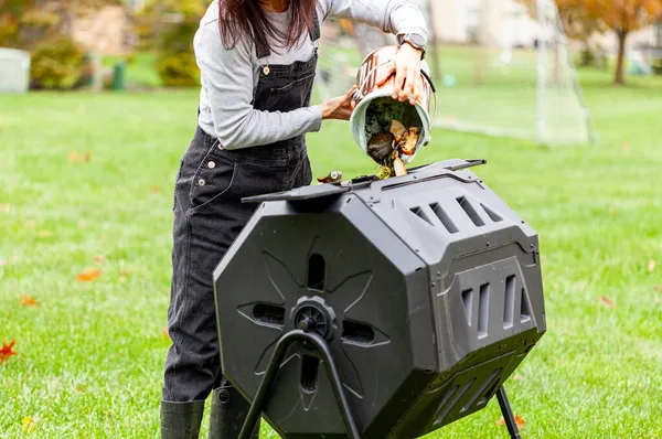 Woman Dumping Small Bin Kitchen Scraps Outdoor Tumbling Composter Backyard — Stock Photo, Image