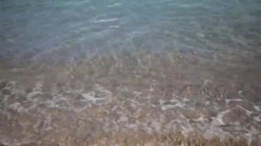 Karadağ 'da güneş doğarken Budva Riviera sahillerinden biri.
