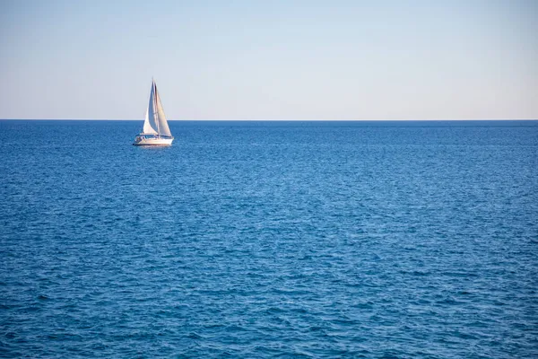 View of small yacht boat sailing in calm open sea in Montenegro — Stock Photo, Image