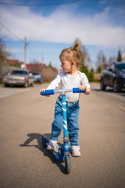 Cute Little Toddler Girl Blue Overalls Riding Kick Scooter Happy — Stock Photo, Image