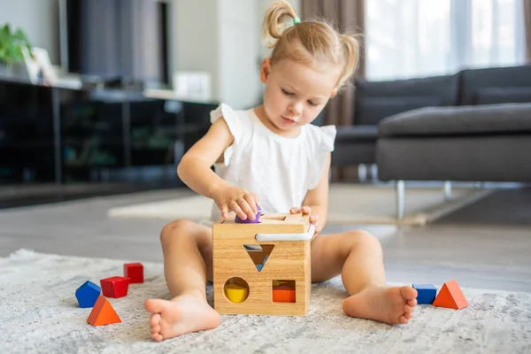 Cute Caucasian Little Girl Playing Floor Home Eco Wooden Toys — Fotografie, imagine de stoc