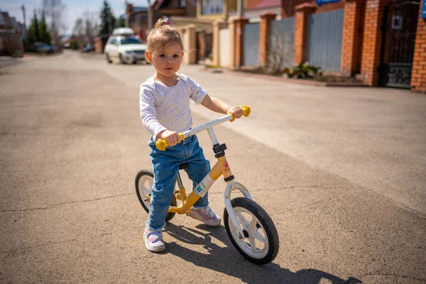 Cute Little Toddler Girl Blue Overalls Riding Run Balance Bike — Stock Photo, Image