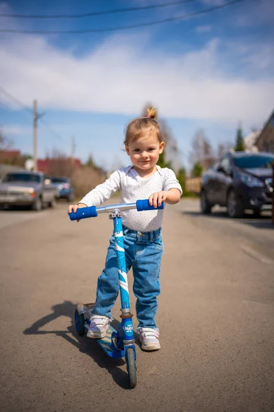 Cute Little Toddler Girl Blue Overalls Riding Kick Scooter Happy — Stock Photo, Image