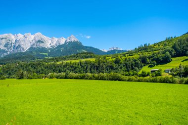 Panorama of beautiful countryside with mountain background in area of Dolomites, Italy. High quality photo
