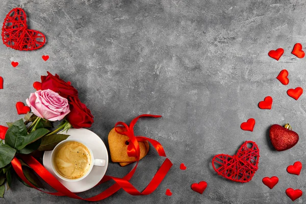 Cup of coffee, heart shaped cookies and a bouquet of red and pink roses on grey background, top view, free space for text — Stockfoto
