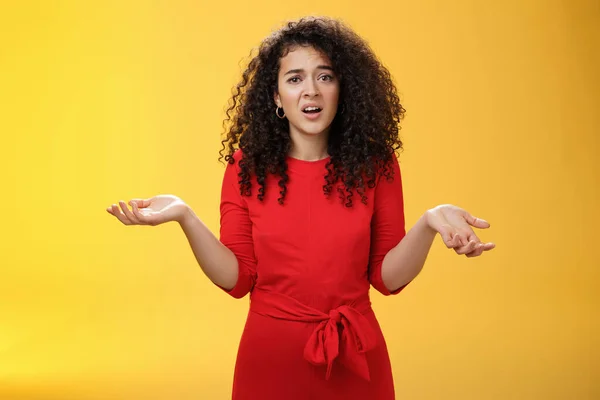 What your problem. Annoyed and confused pissed girlfriend with curly hair in elegant party dress shrugging with hands spread sideways and clueless grimace, waiting explanation during argument — Stockfoto