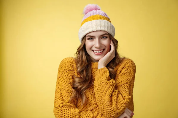 Dreamy tender romantic good-looking woman wearing warm hat knitted sweater giggling smiling flirty seducing you look interested happy, lean head palm listening curious story, yellow background — Stock Photo, Image