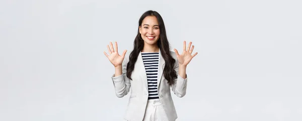 Business, finance and employment, female successful entrepreneurs concept. Smiling elegant asian woman in suit, businesswoman smiling and showing ten fingers, propose good deal — Stock Photo, Image