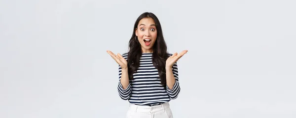 Lifestyle, people emotions and casual concept. Surprised excited asian woman found out awesome big news, clap hands amazed and gasping wondered, standing white background — Stock Photo, Image