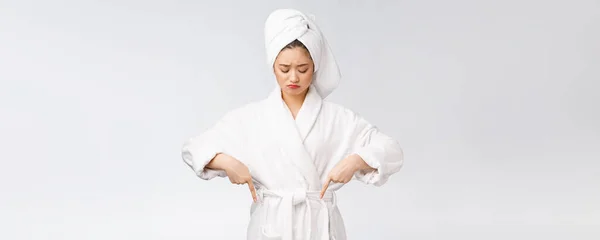 Young beautiful woman wearing shower towel after bath over isolated white background pointing with finger. — Stock Photo, Image