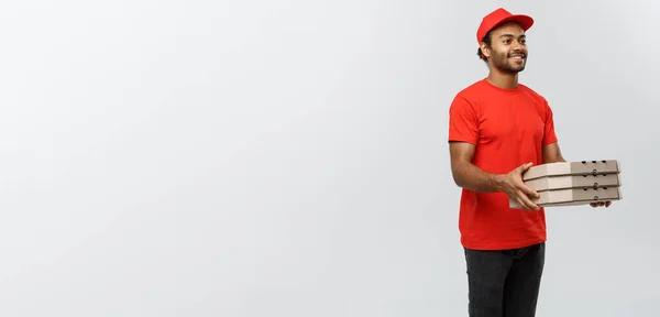 Delivery Concept - Portrait of Handsome African American Pizza delivery man. Isolated on Grey studio Background. Copy Space. — Stock Photo, Image