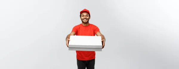 Delivery Concept - Portrait of Handsome African American Pizza delivery man. Isolated on Grey studio Background. Copy Space. — Stock Photo, Image