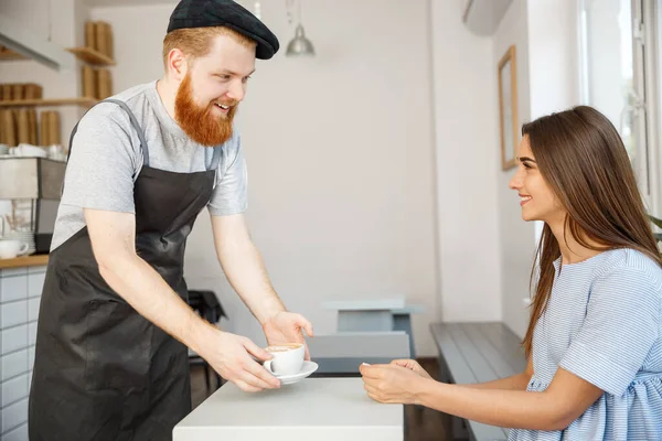Coffee Business Concept - Waiter or bartender serving hot coffee and talking with caucasian beautiful lady in blue dress at Coffee shop. — Stock Photo, Image
