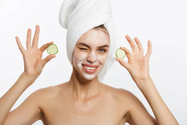 Beauty Portrait Of Smiling Woman With Towel On Head And Slice Of Cucumber In Hand Isolated On White Background. — Stock Photo, Image