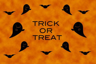 Portrait of Halloween decorations with ghost on orange background.