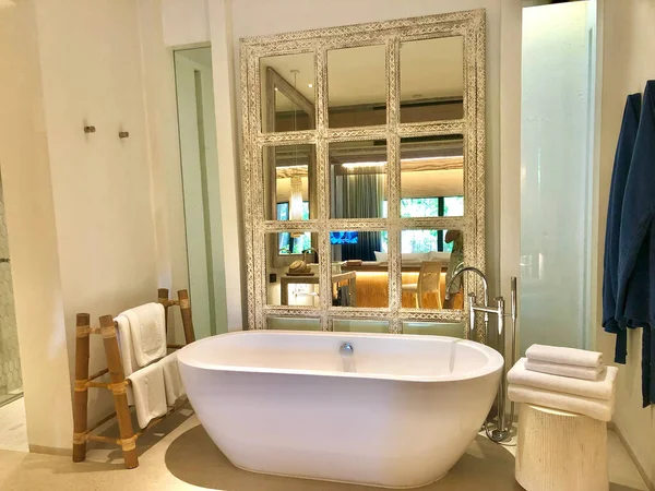 bathroom interior background and white spa towels on wood.