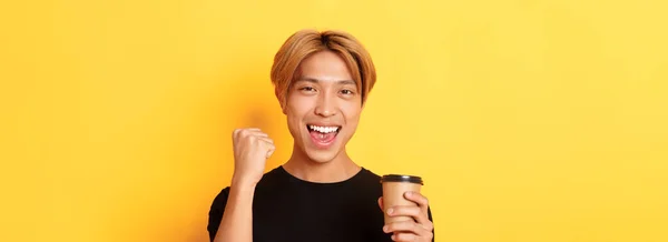 Close Energized Handsome Asian Guy Fist Pump Joyfully While Drinking — Stock Photo, Image