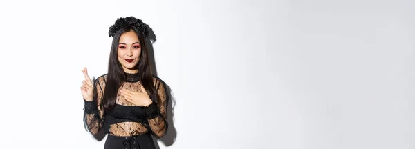 Imagem Mulher Asiática Atraente Vestido Festa Halloween Fazendo Desejo Segurando — Fotografia de Stock