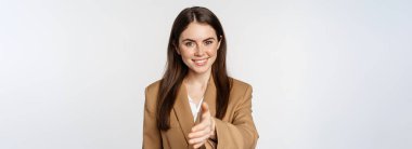 Portrait of smiling businesswoman extend hand for handshake, greeting business partner, saleswoman welcome client, white background.