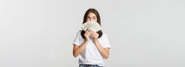 Excited Dreamy Girl Holding Money Looking Upper Left Corner Thinking — Stock Photo, Image