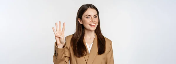 Portrait Corporate Woman Saleswoman Showing Number Four Fingers Smiling Standing — Zdjęcie stockowe