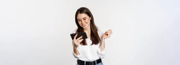 Happy Smiling Woman Watching Mobile Phone Looking Smartphone Laughing Standing — Stockfoto