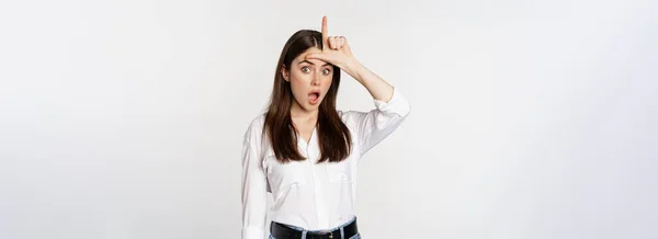 Young Woman Mocking Loser Showing Word Sign Forehead Gasping Disbelief — Foto de Stock