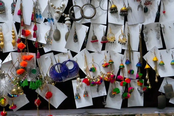 stock image Various colorful shapes and shades of earrings , handicrafts on display at Jaisalmer city, Rajsathan, India.