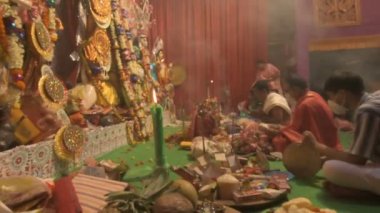 Howrah, India - October 15th, 2021 : Sandhi Puja, the sacred juncture of Ashtami, eighth day and Nabami, nineth day, as Hindu ritual for praying to Goddess Durga. Durga puja festival.