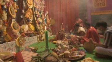 Howrah, India - October 15th, 2021 : Sandhi Puja, the sacred juncture of Ashtami, eighth day and Nabami, nineth day, as Hindu ritual for praying to Goddess Durga. Durga puja festival.